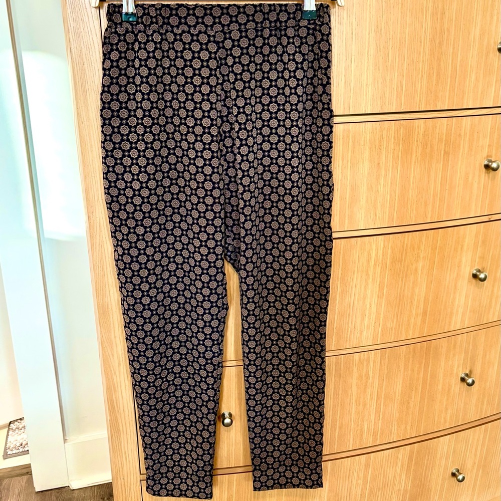Navy and White Geometric Wide-Leg Trousers tapered at the bottom.